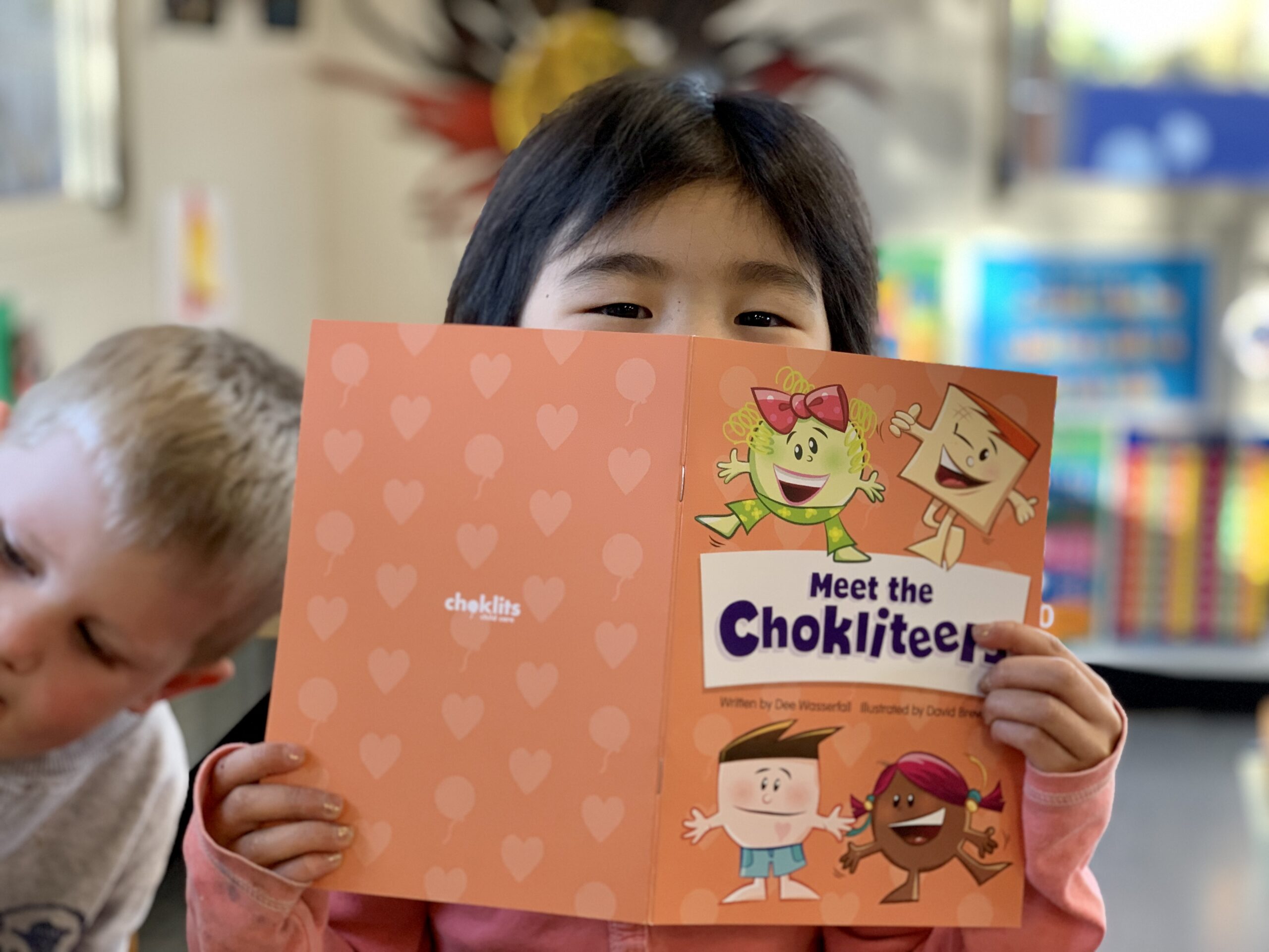Reading to children at Choklits Child Care