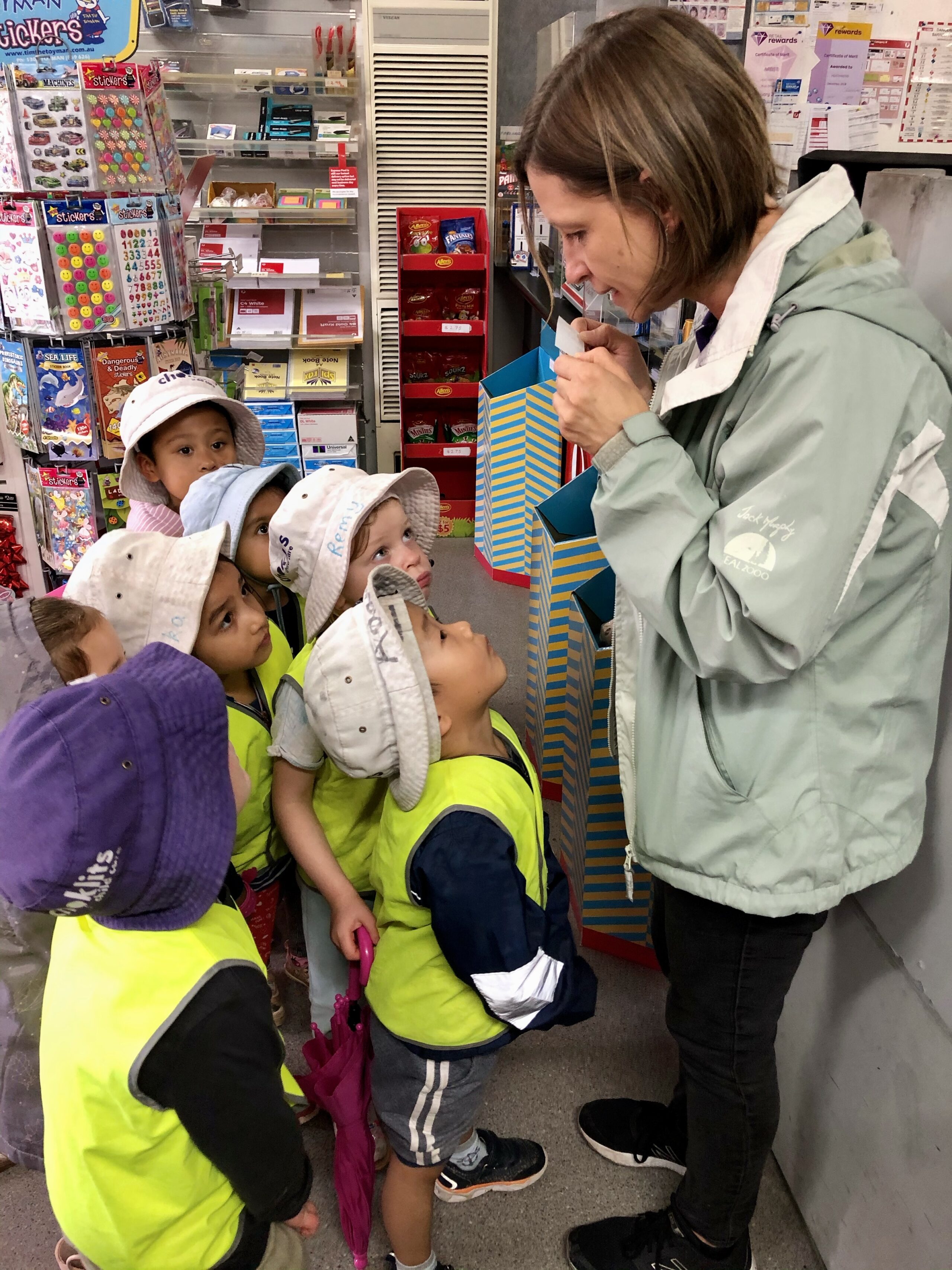 Children posting letters on our post office trip
