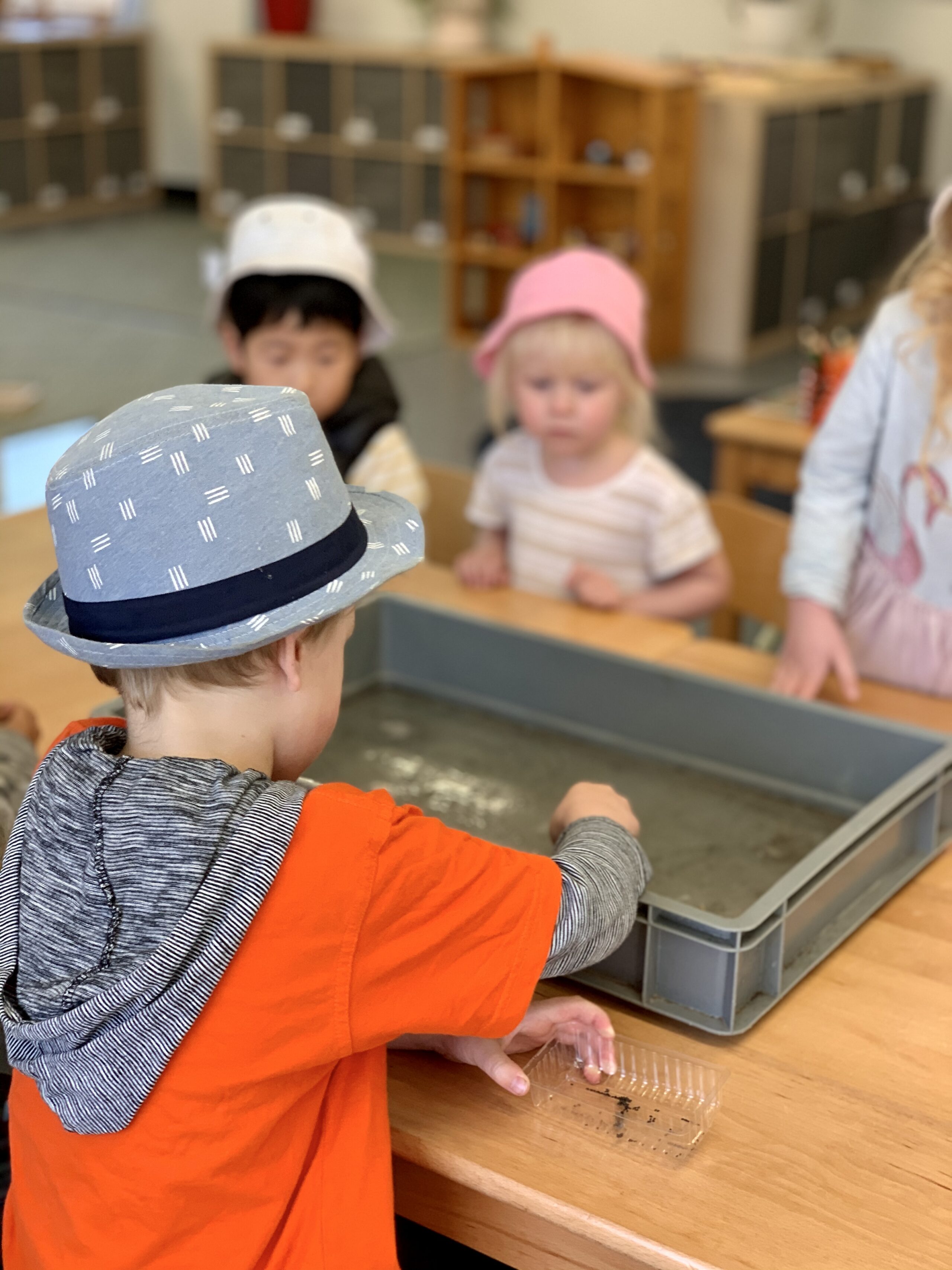 Children exploring textures during sensory play